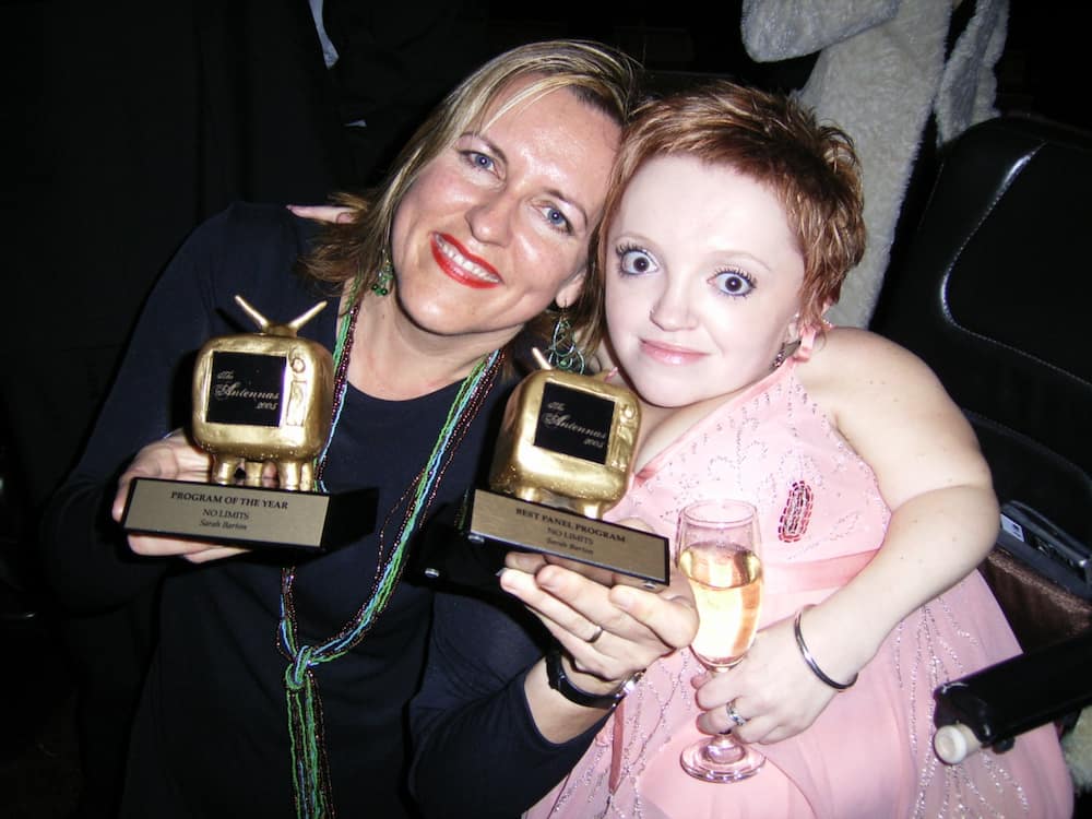 Stella with Sarah Barton who holds 2 Antenna awards for No Limits. Stella holds a glass of champagne.