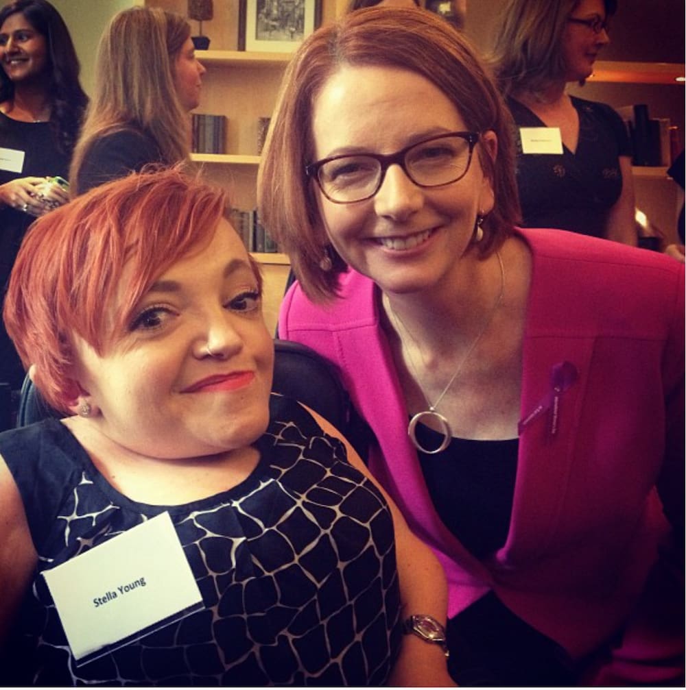Julia Gillard leans in close and smiles to pose with Stella